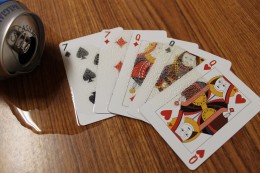 Playing cards with beer spilled on them