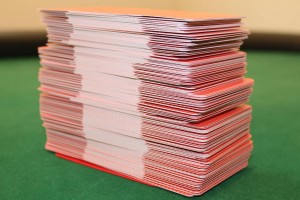Six decks of Denexa 100% Plastic Playing Cards, shuffled together