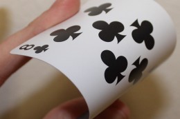 a playing card being bent