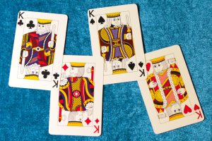 Four king playing cards
